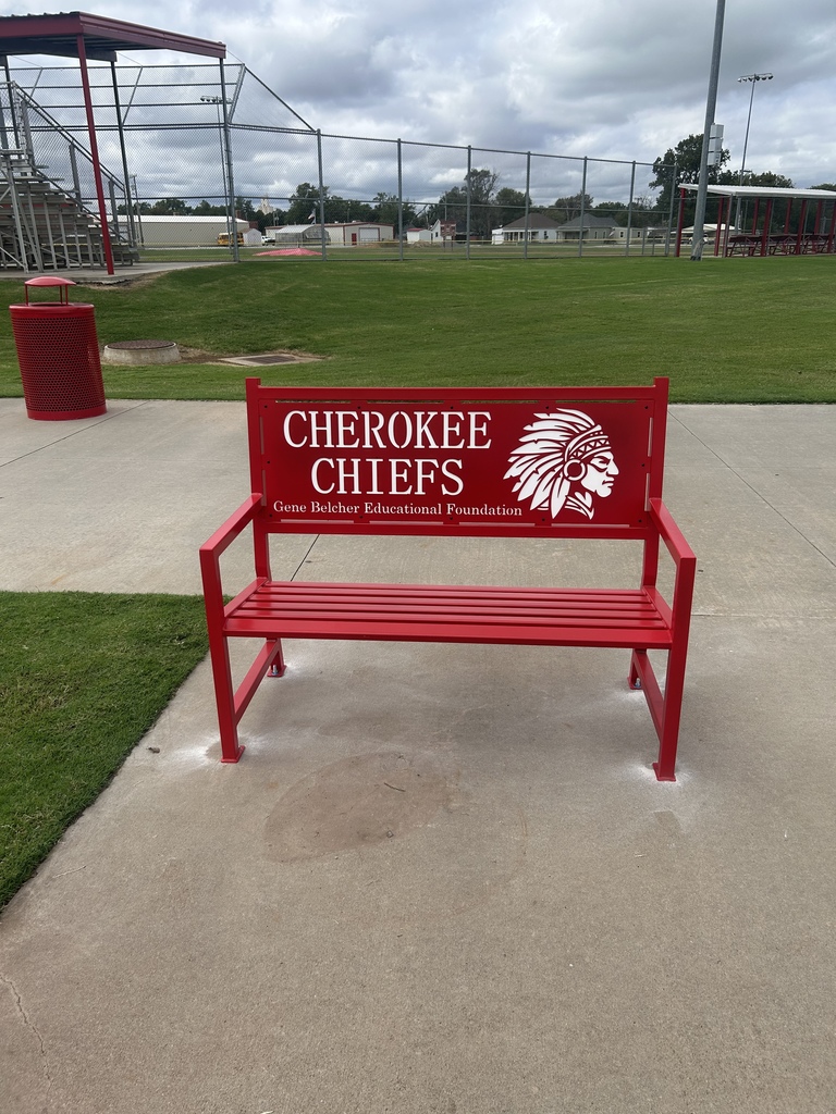 Red bench at the sports complex donated by the Gene Belcher Foundation