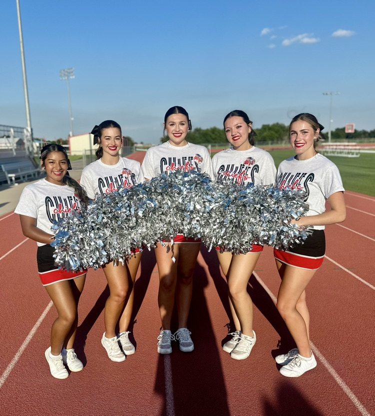 photo of 5 Class of 2026 - Senior cheerleaders standing on the sidelines.