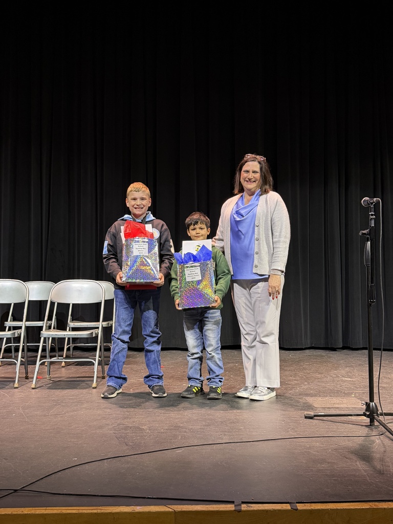 Photo of 1 adult and 2 students. Spelling Bee Jan 2026. Elementary Level