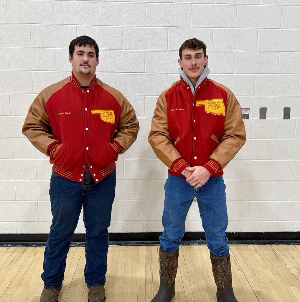 Picture of 2 students receiving Class B2 All Star jacket for the 2025 Varsity Football Season.
