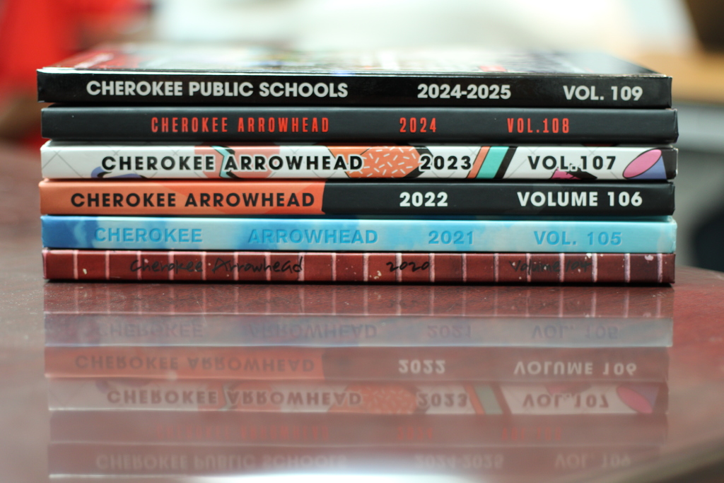 Photo of a stack of yearbooks for Cherokee PS.