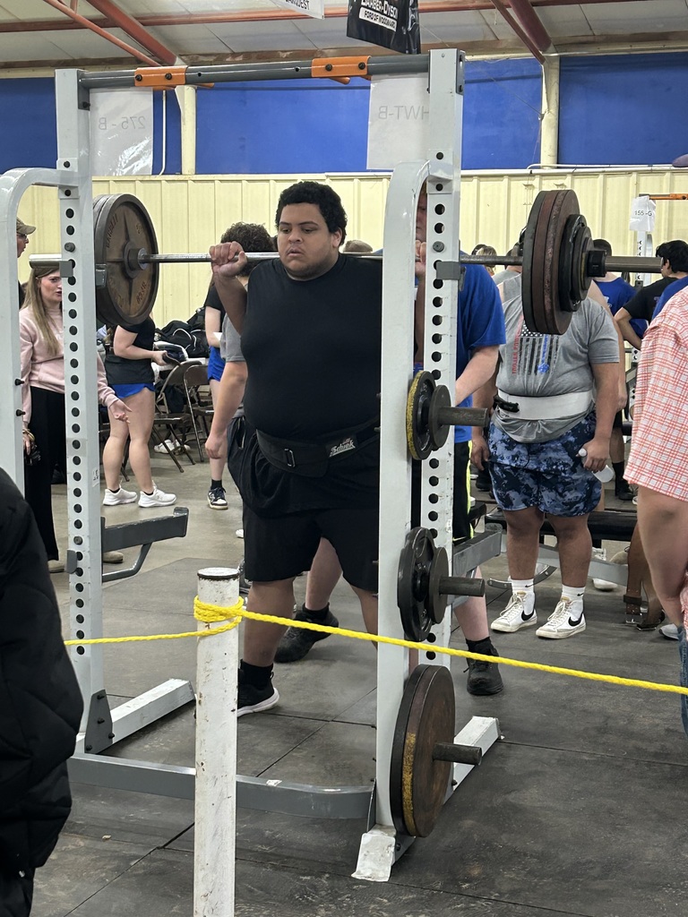 Student lifting weights at a competition. 