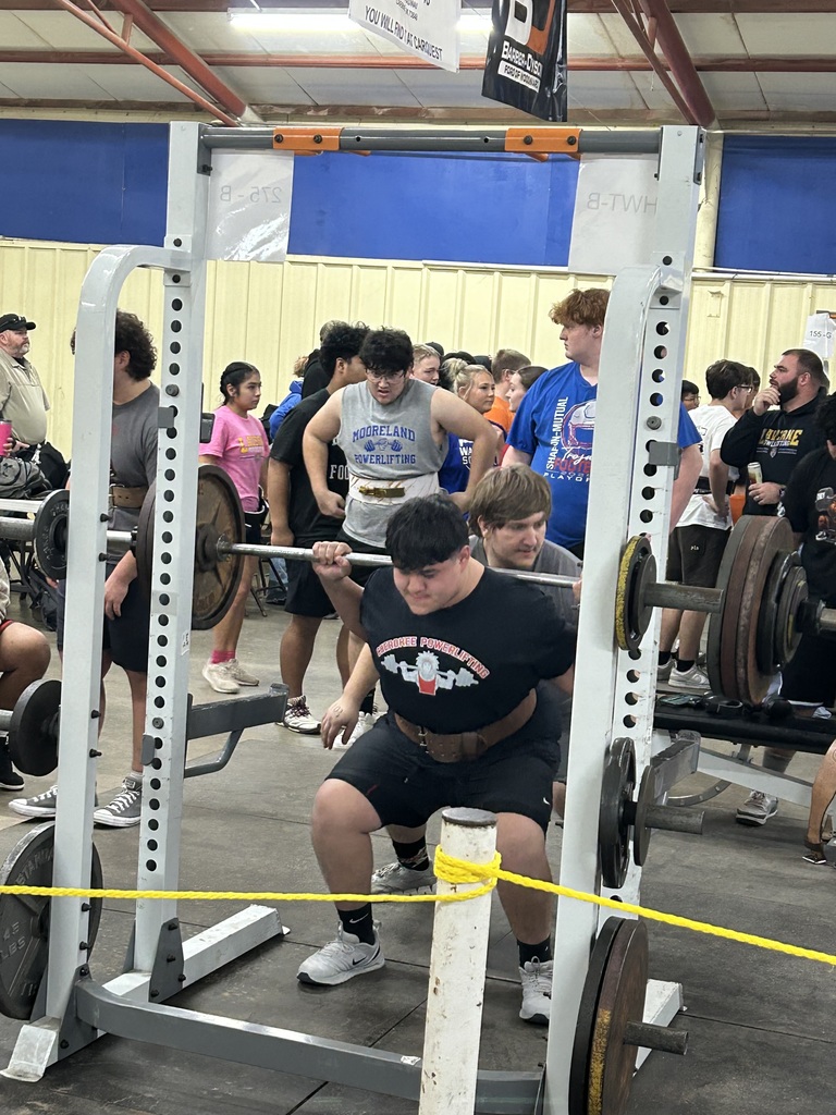 Student lifting weights at a competition. 