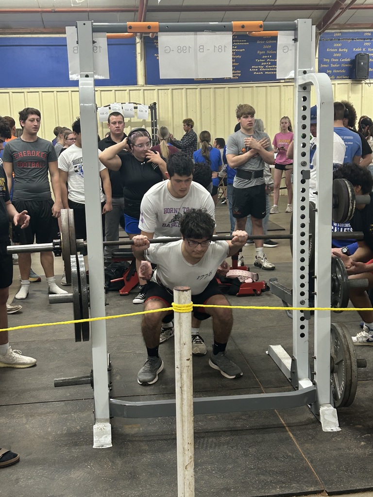 Student lifting weights at a competition. 