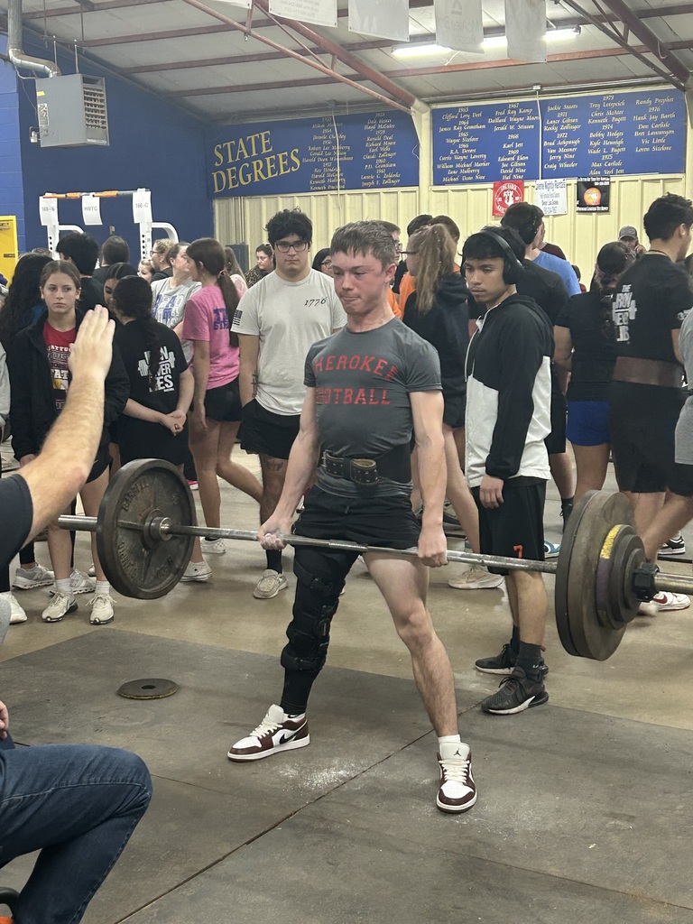 Student lifting weights at a competition. 