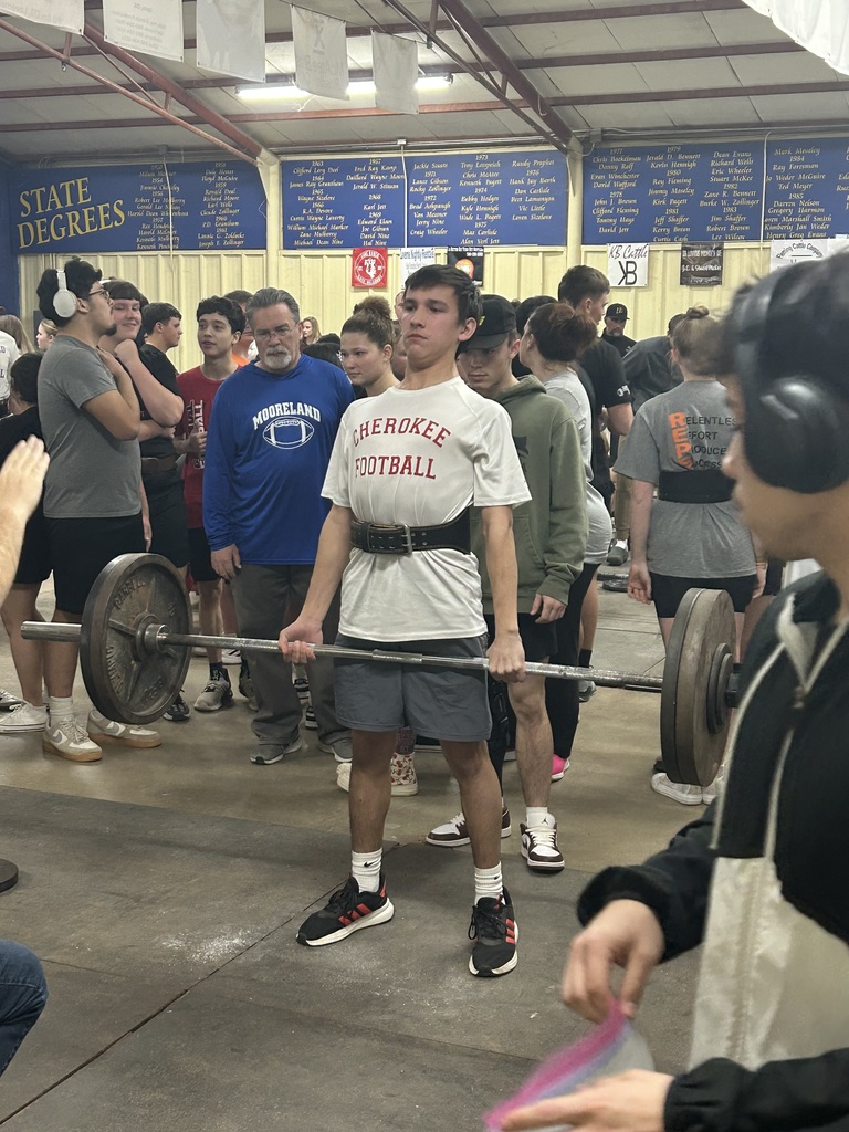 Student lifting weights at a competition. 