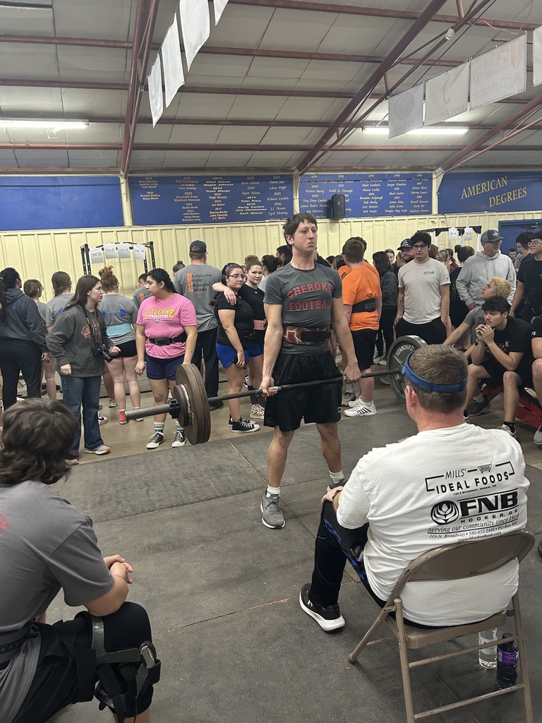 Student lifting weights at a competition. 
