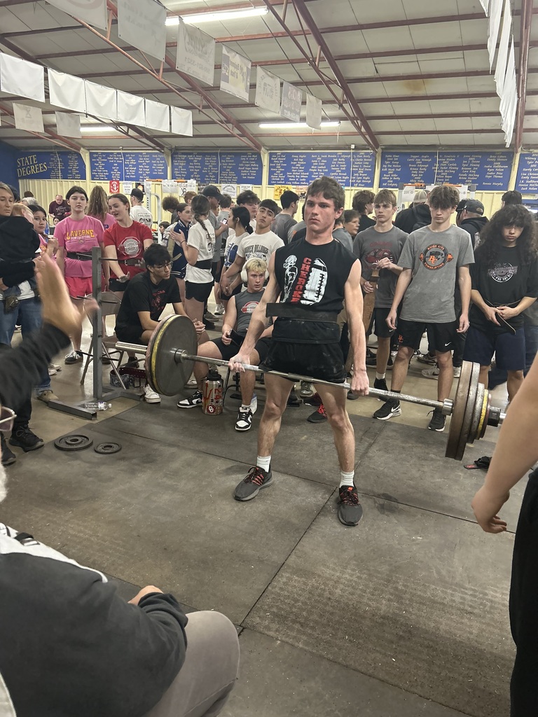 Student lifting weights at a competition. 