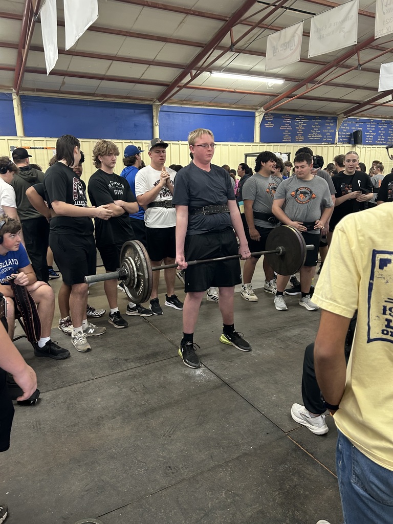 Student lifting weights at a competition. 