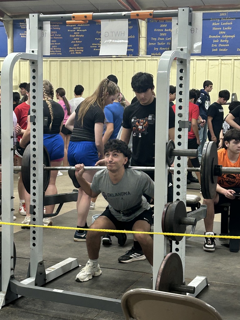 Student lifting weights at a competition. 