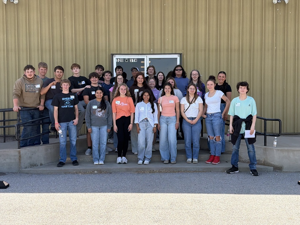 Class of 2026 in front of a building.