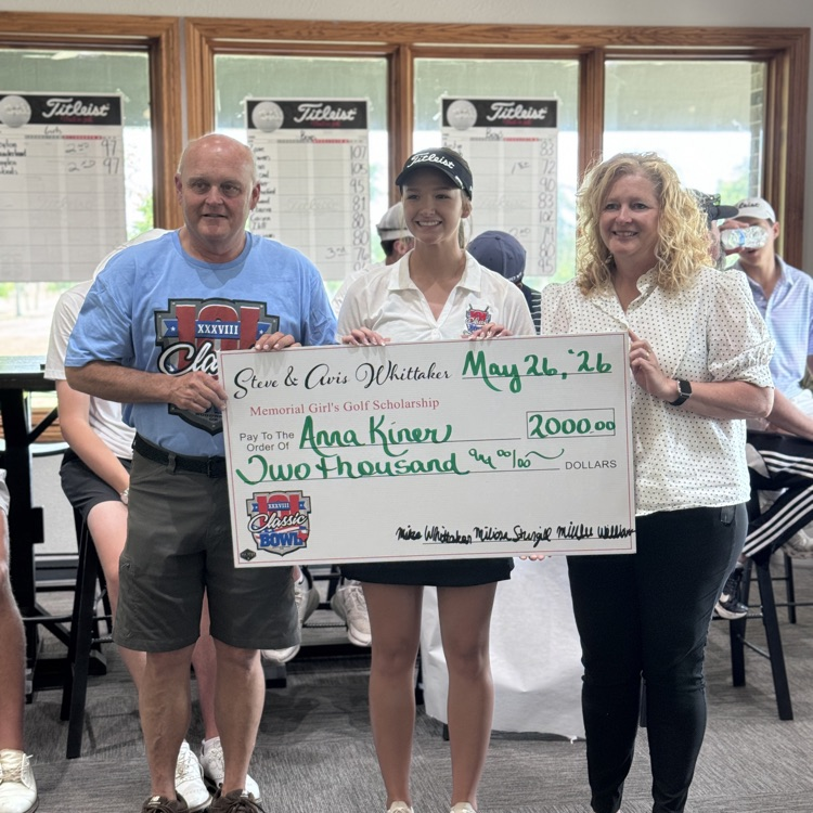 student picked with 2 adults being award a scholarship  