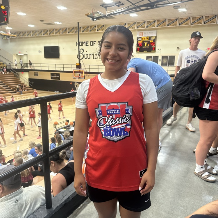 photo of female student in a basketball gym at the k101 classic girls basketball game  
