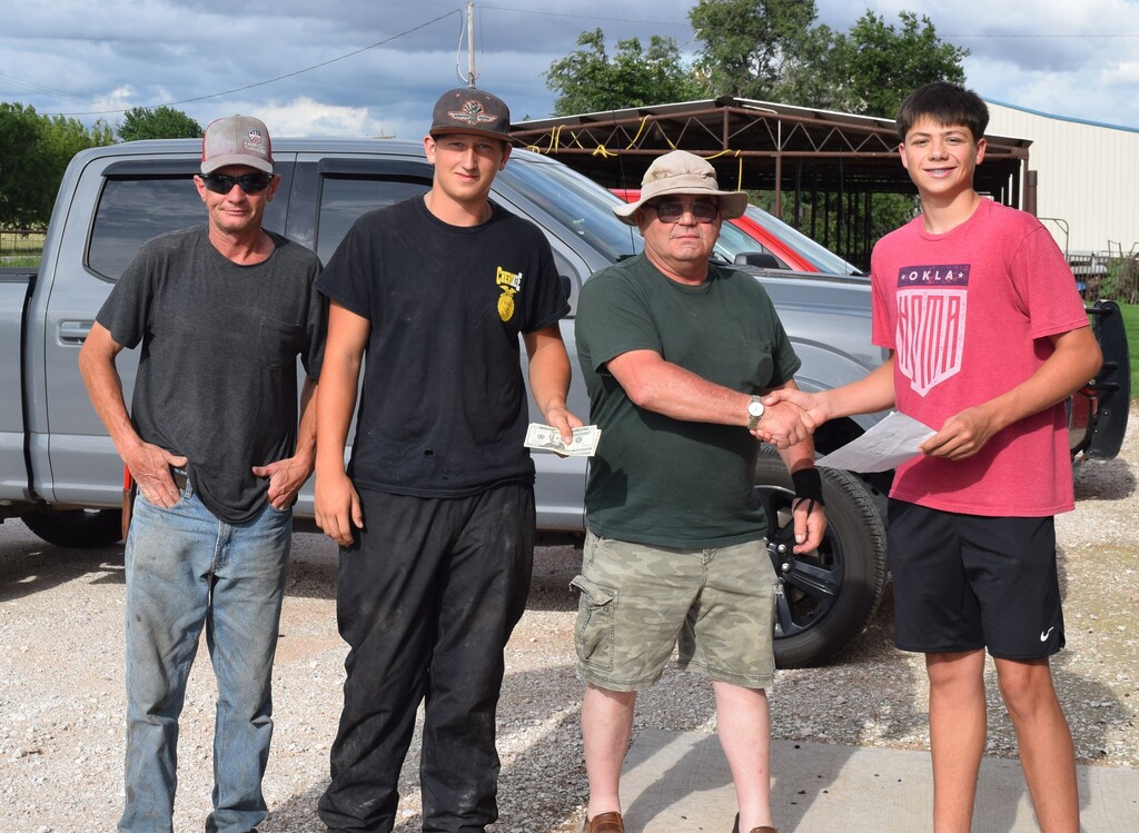 2 adults and 2 students shaking hands