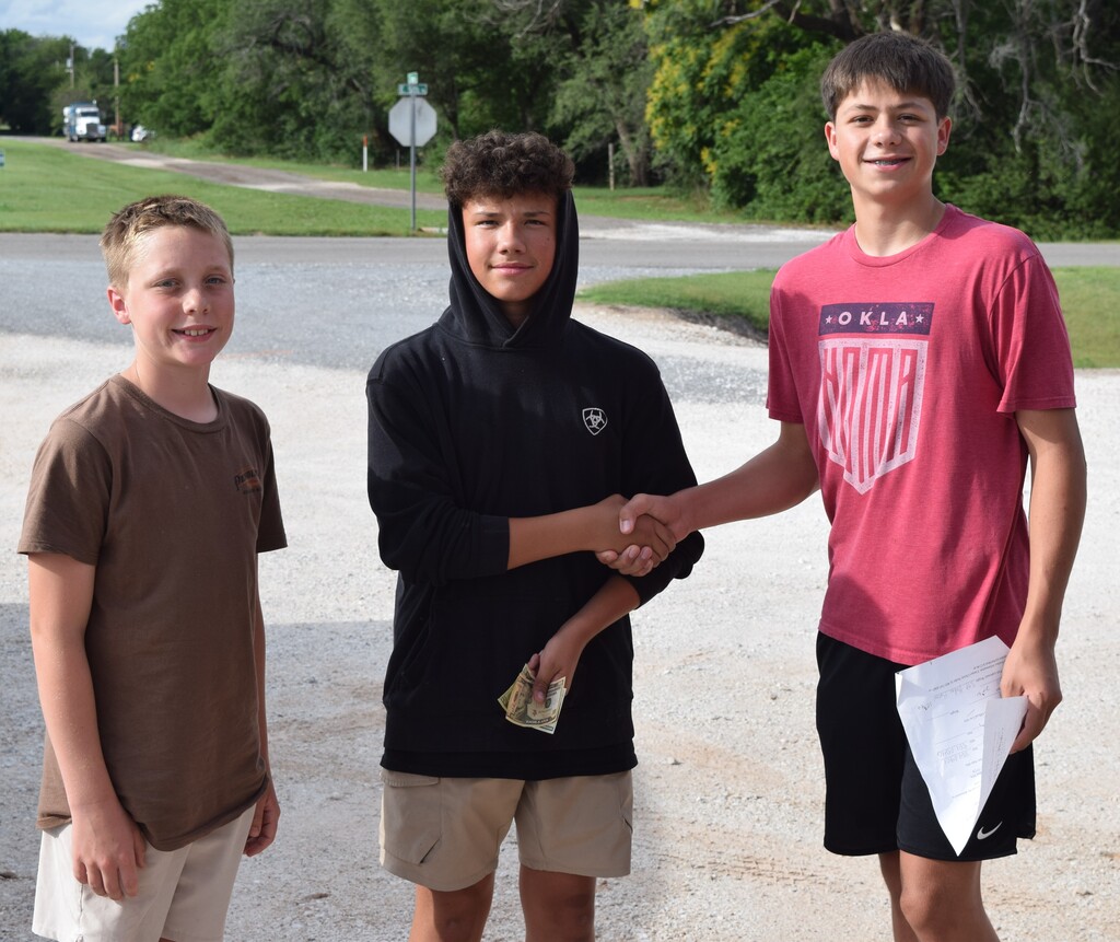 3 students shaking hands