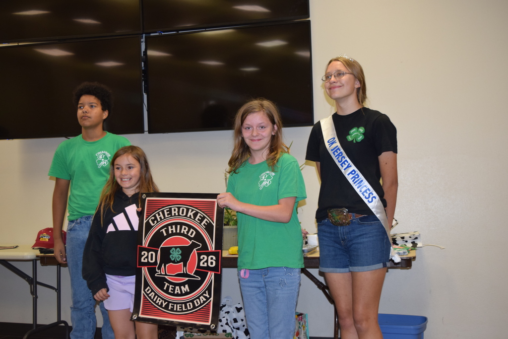 4 students with a banner.