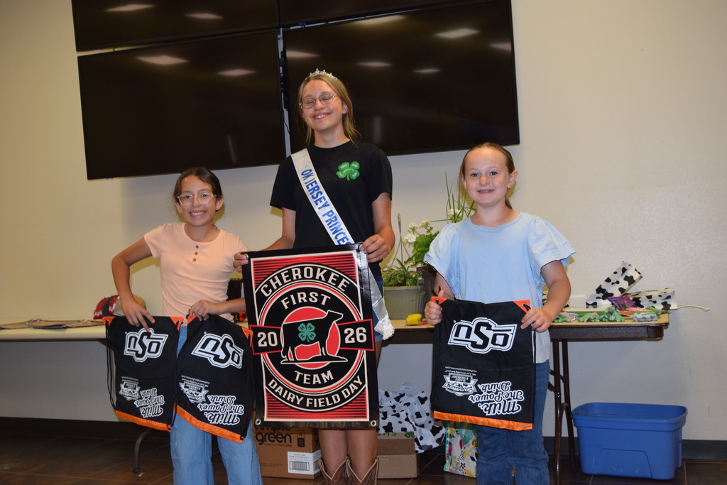 1st Place 4-H Team:  Alfalfa County, Cherokee 4-H L to R- Jocelyn Ordonez, Aubrey Marrero, Julie Beisel.  3 students with a banner.