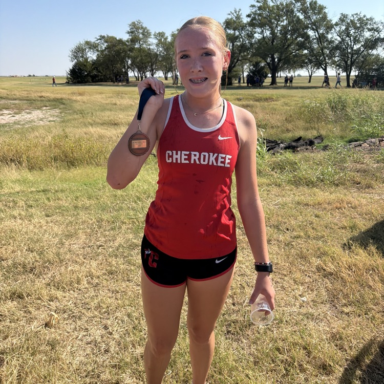 1 student in red uniforms at cross country meet