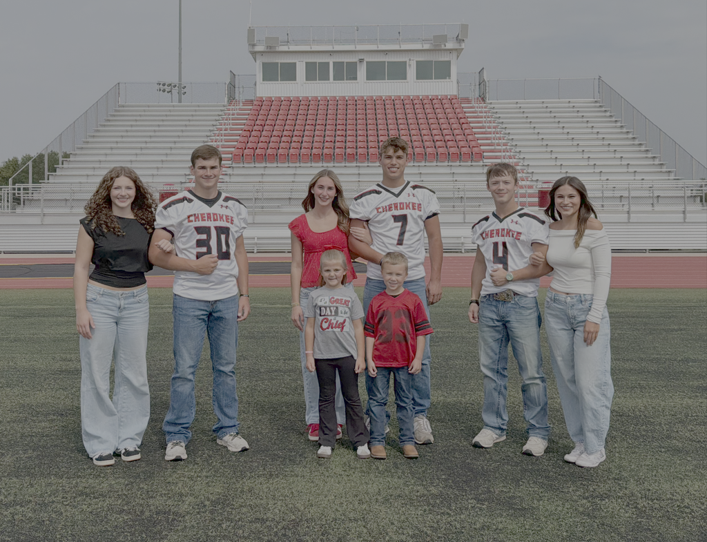 Football Homecoming Candidates. Group of 6 HS Students and 2 Elementary students standing on a football field with football bleachers in the background.