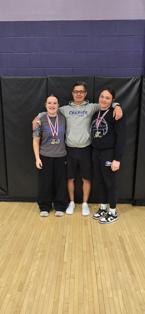 Addy Boss, Katie Hester, and Coach Vigil at the Kansas  State Power Lifting Meet