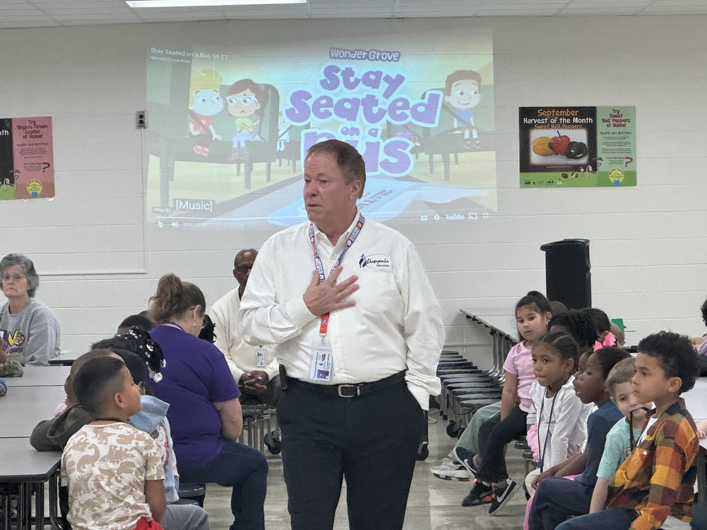 gentleman speaking to a group of students