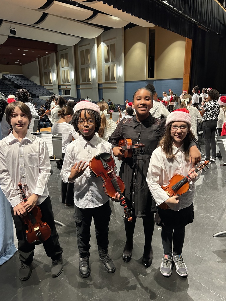 5th Grade Strings students with instruments