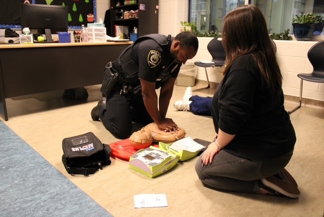 Police officer instruction on CPR