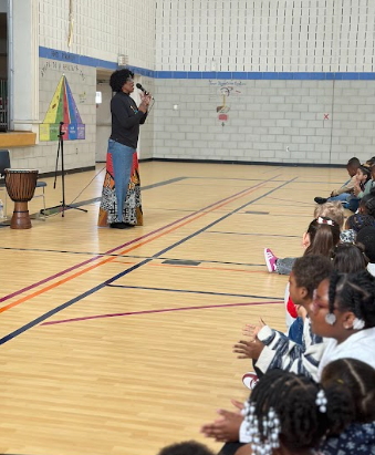 students watching an African storyteller