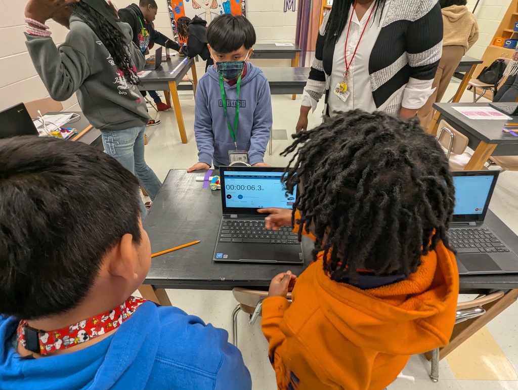 students looking at a stopwatch on a chromebook