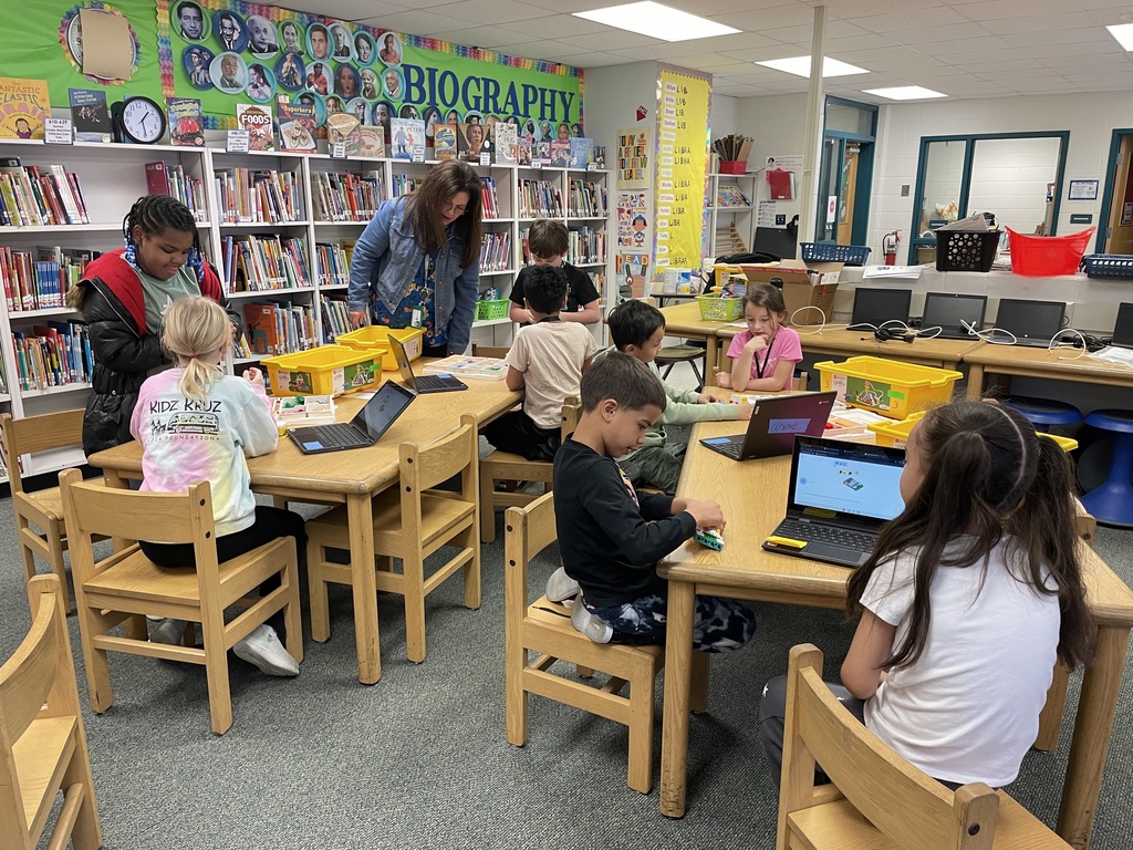 Students using LEGO Spike kits;