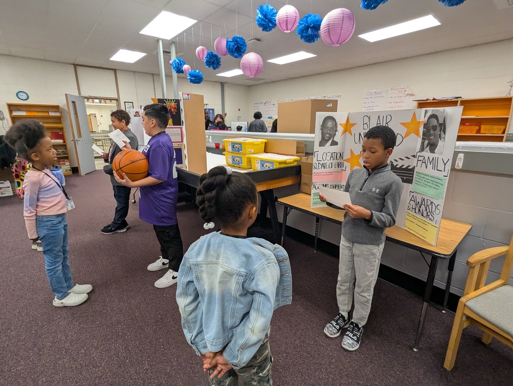 students presenting to younger students