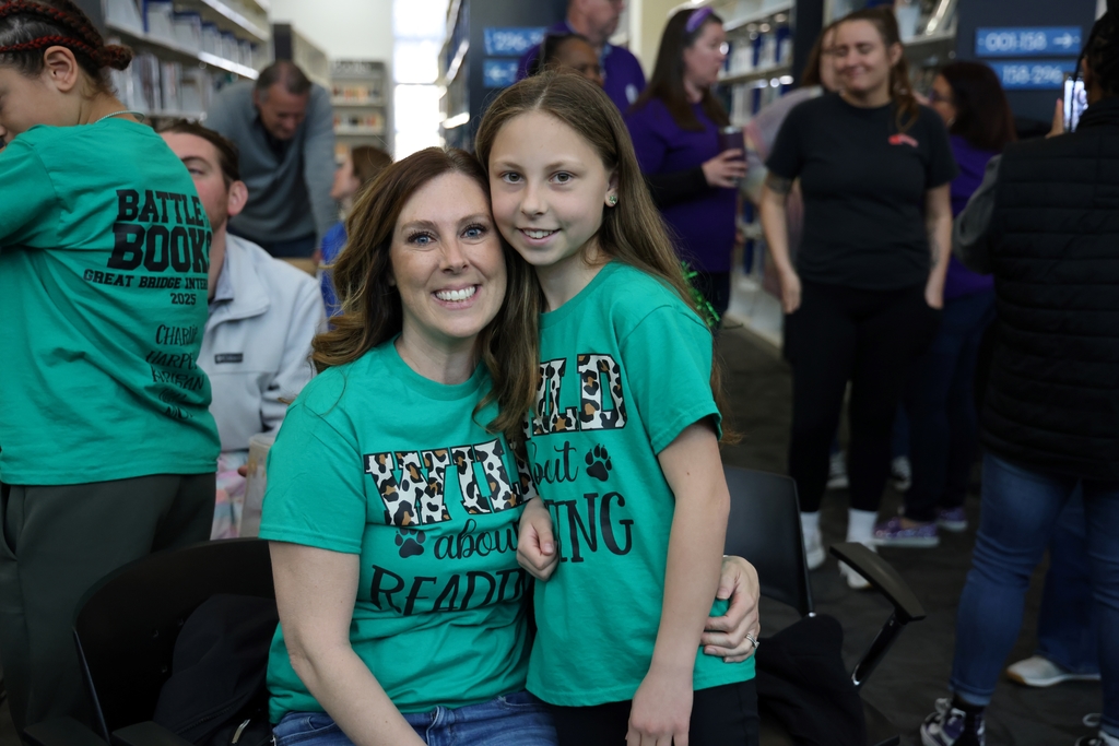 A student smiling with her mom.