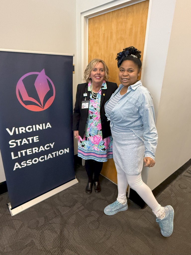 student smiling with administrator