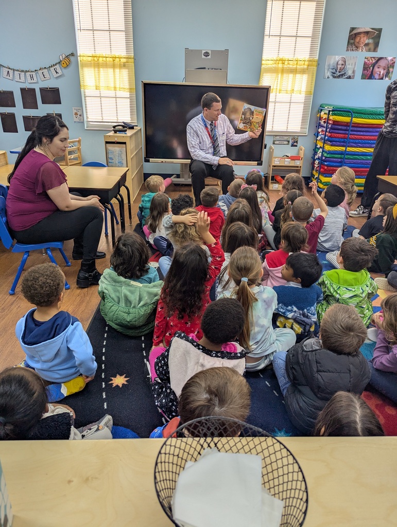 Mr. Mason reading to a private preschool.