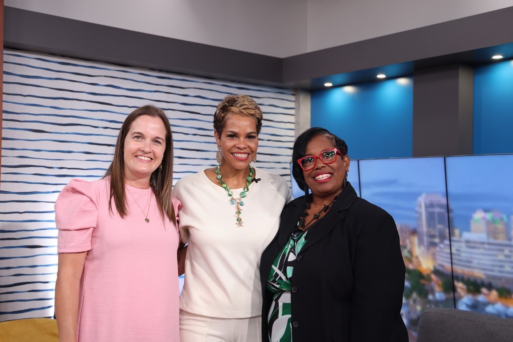 Lisa, the host, and Laura smiling together.