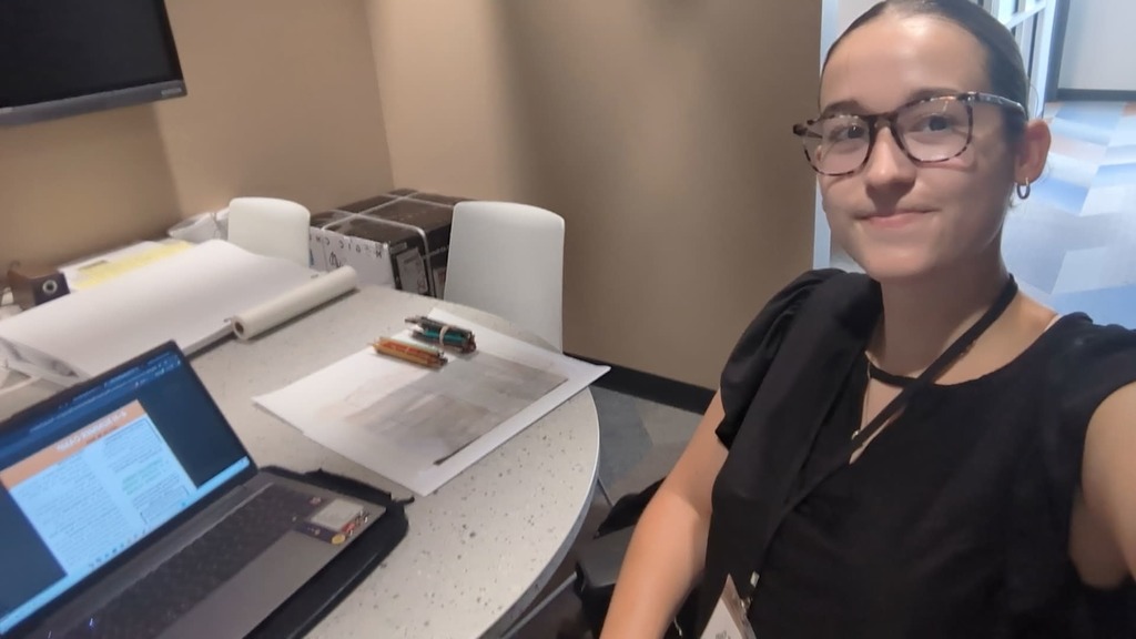 Marcy working at a desk.