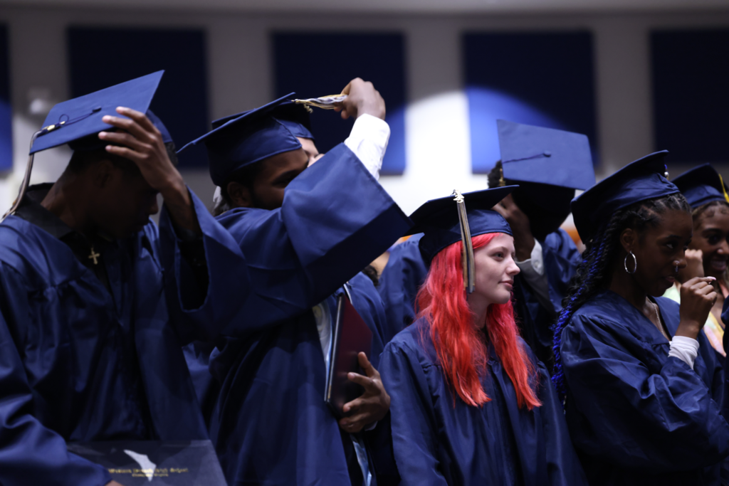 Graduates changing tassels.