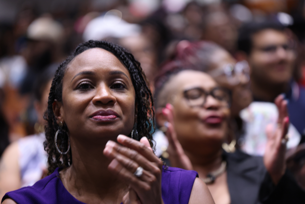 Woman clapping.