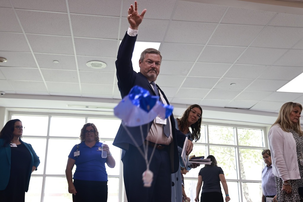 admin throwing parachute man