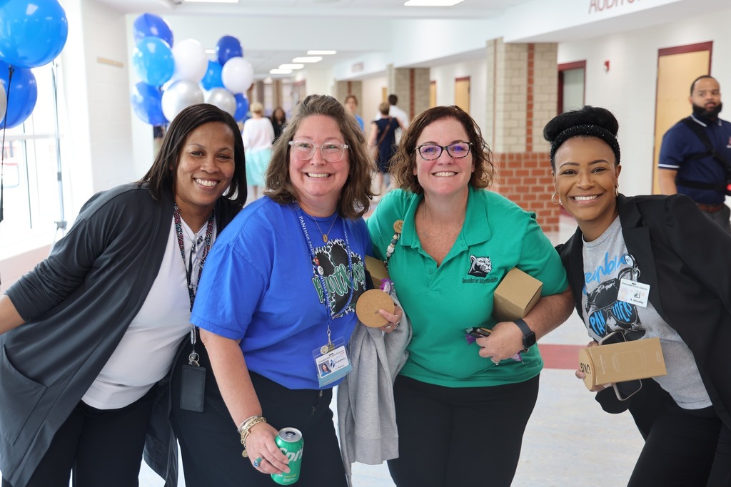 group of female administators smiling for camera