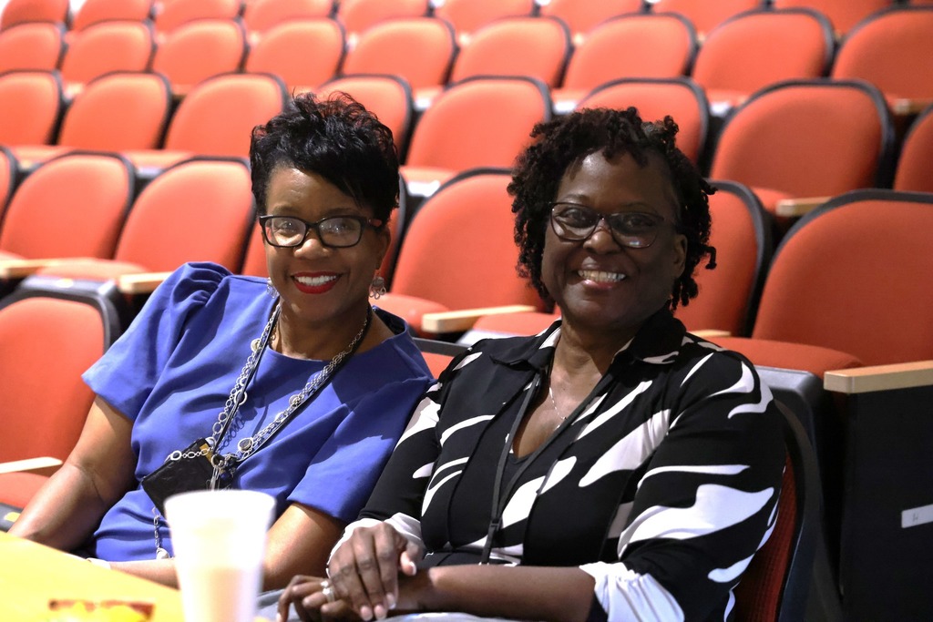 two women smiling at camera