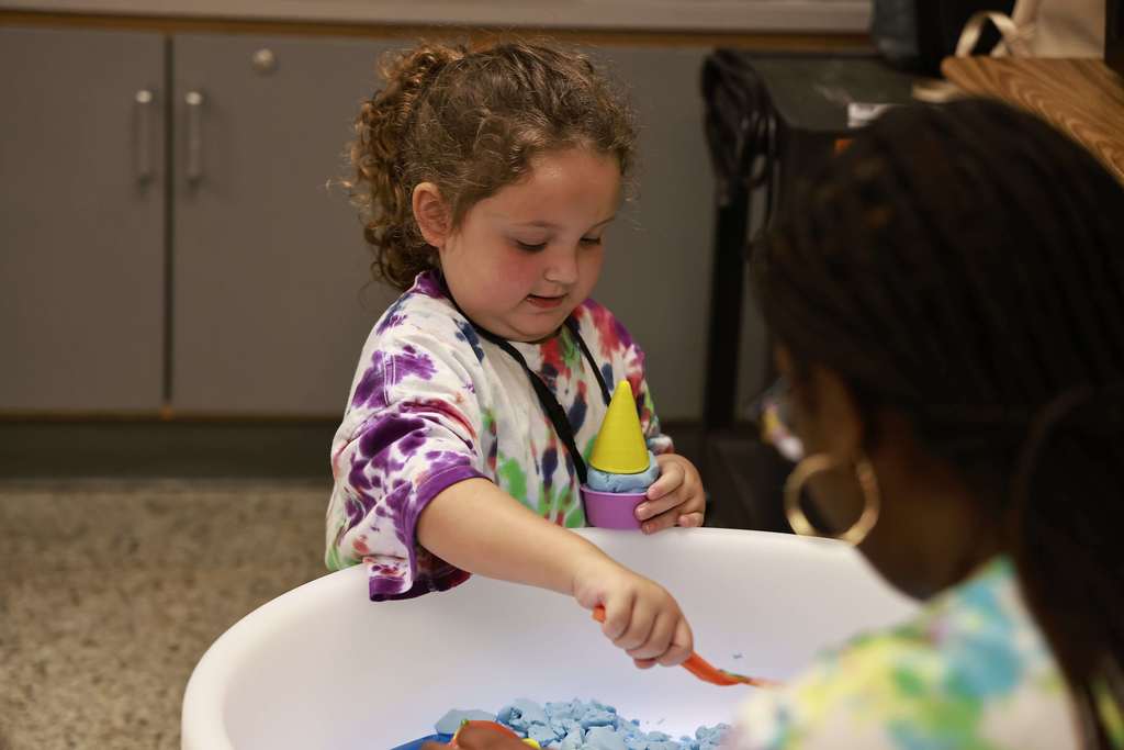 A student plays with toys during the Bridge to Kindergarten summer learning program