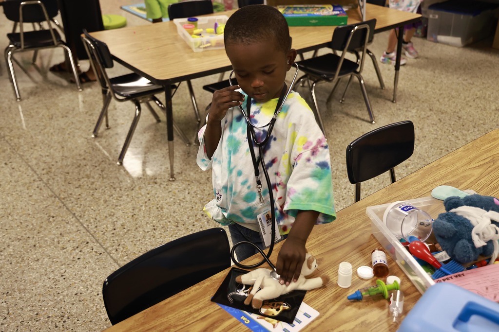A student plays with toys during the Bridge to Kindergarten summer learning program