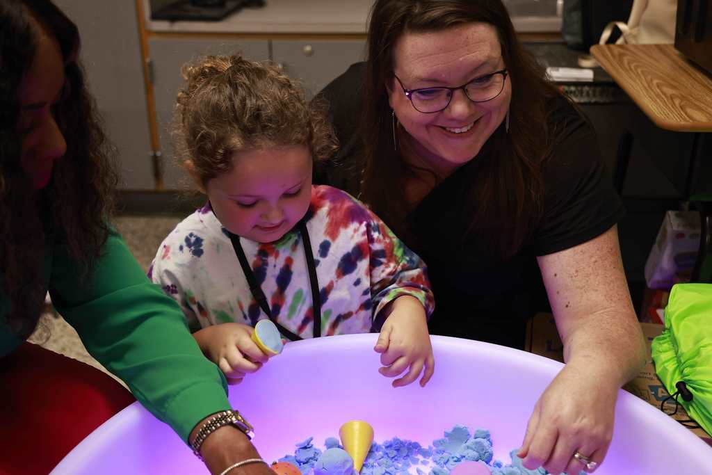 A student plays with toys during the Bridge to Kindergarten summer learning program