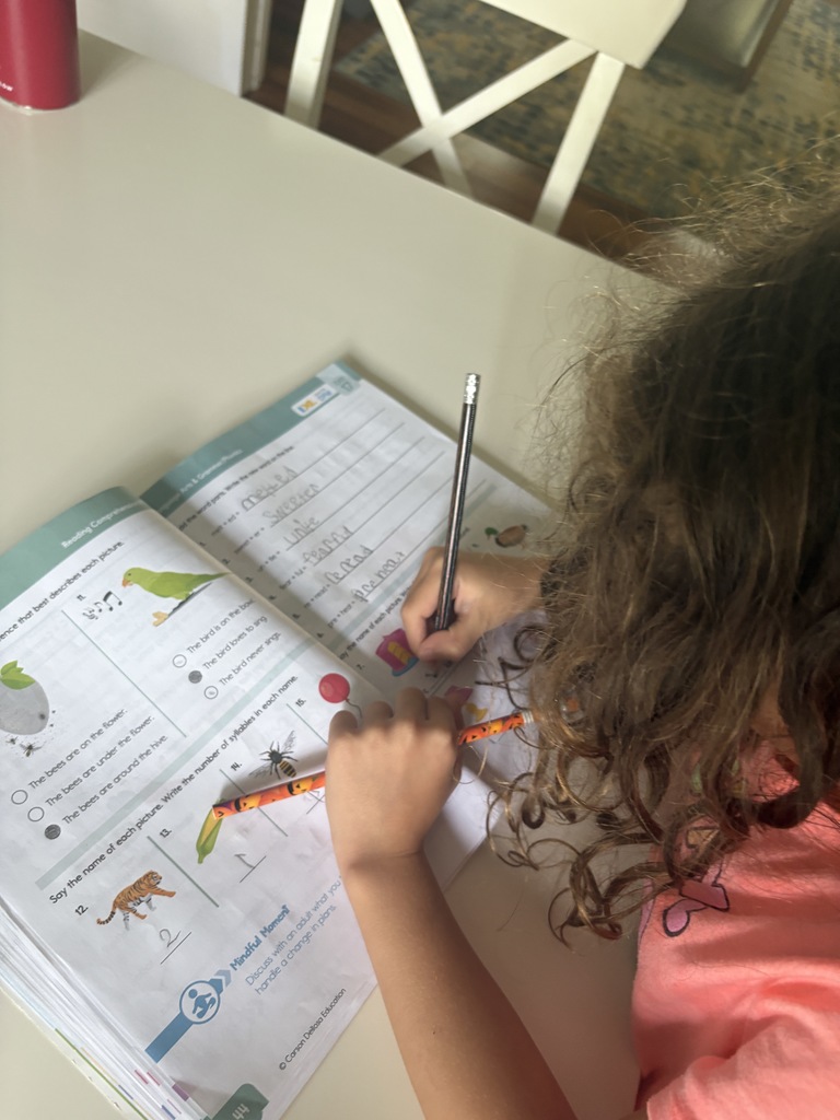 student writing in book