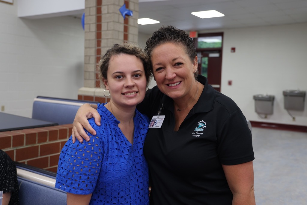 new female teacher with principal