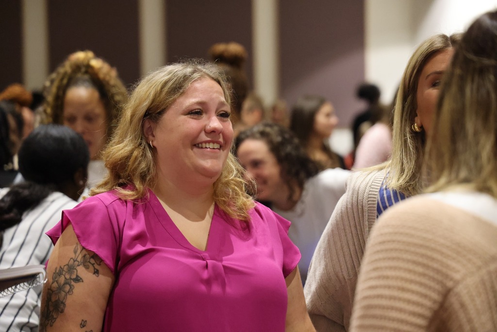 female smiling and talking