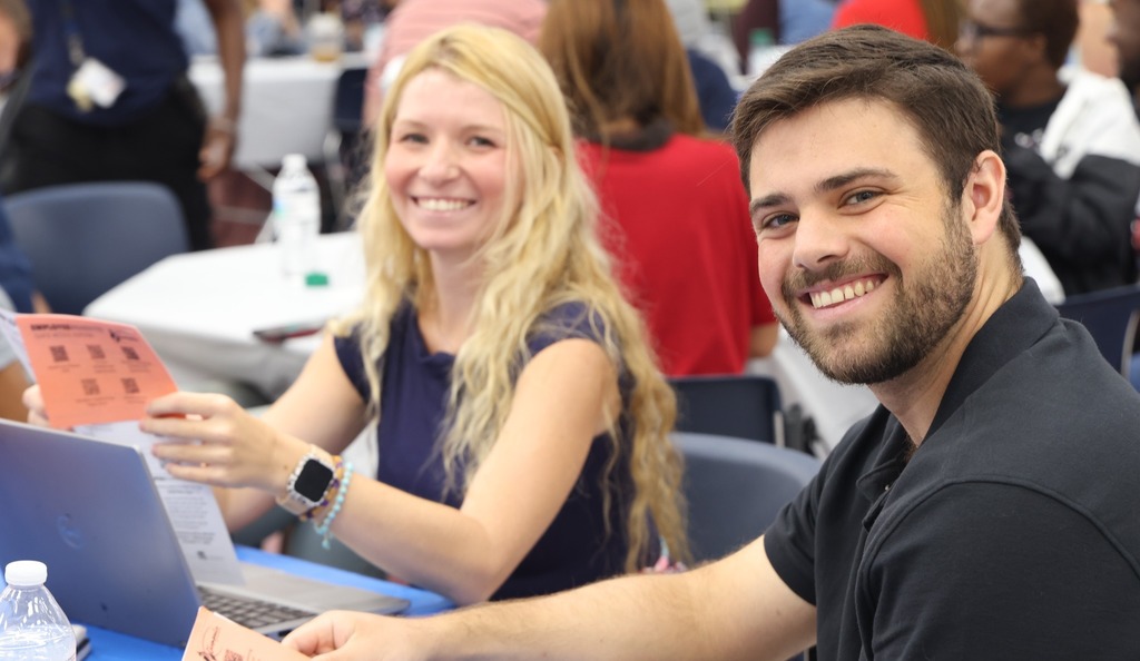 two new teachers smiling at camera