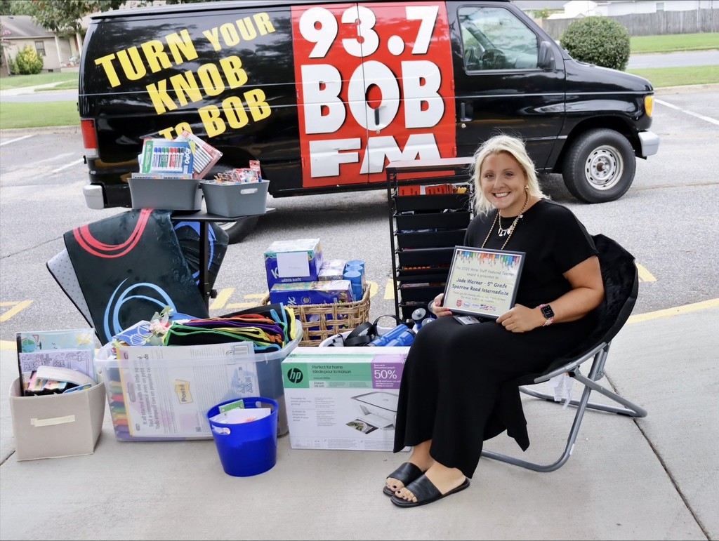 Ms. Warner being presented  with the award and supplies