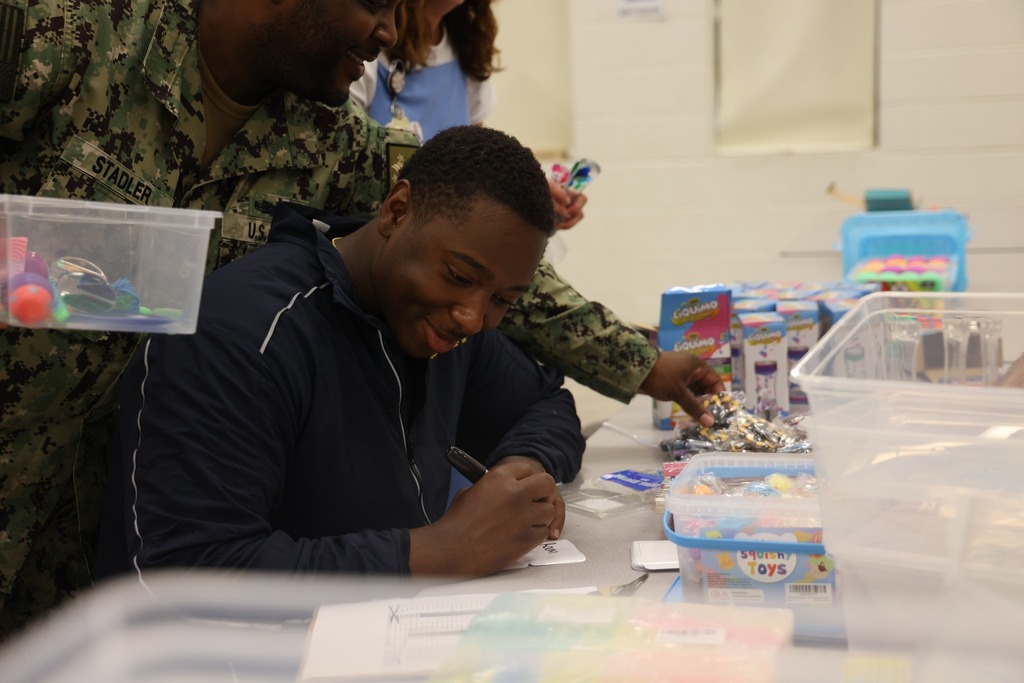 Navy volunteer working at a school.